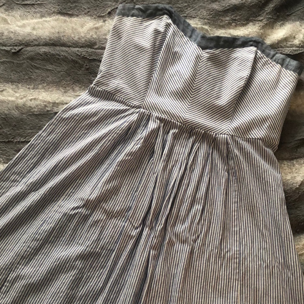 Knee-length, strapless dress.